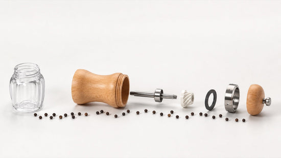 Exploded pepper mill showing the food-contact hopper, mechanism, shaft and seals