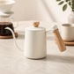 Cream-white 350 ml gooseneck coffee kettle with a wooden handle and lid knob.